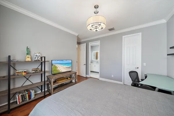 an aerial view of a house with a yard and lake view