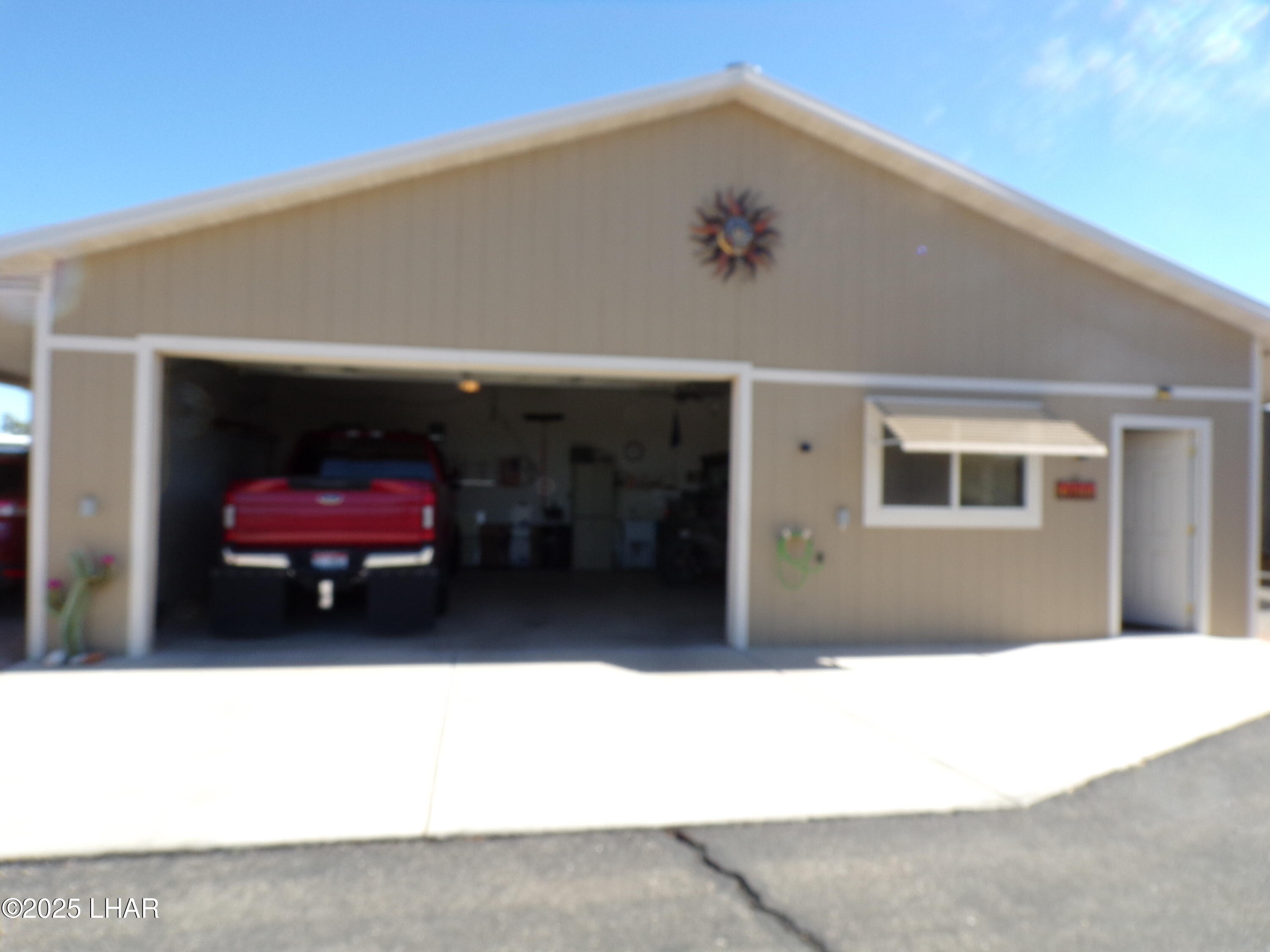 25569 Ochoco Way Bouse, AZ 85325 - Photo 29 of 71 GARAGE DOOR OPEN TRUCK PARKED INSIDE