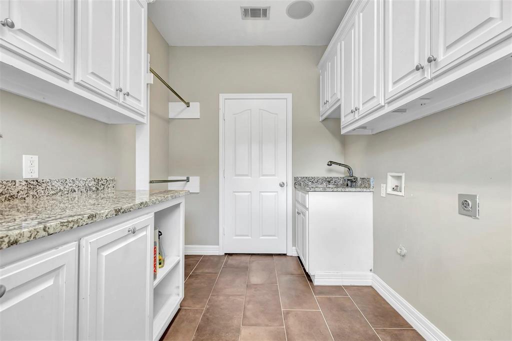 1700 Rock Ridge Road Lucas, TX 75002 - Photo 15 of 37 Love this laundry room with all the extra cabinetry, countertop, and sink.