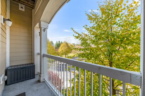 a view of balcony with wooden floor