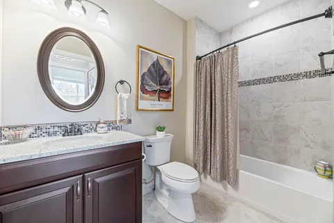 a bathroom with a toilet a sink and a bathtub