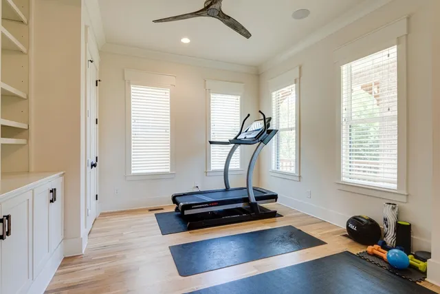 a room with gym equipment and a window