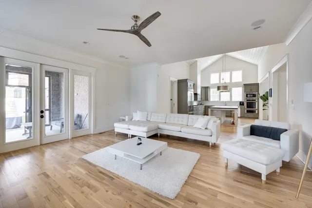 a living room with furniture rug and wooden floor