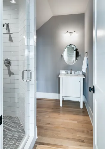 a view of a room with wooden floor and staircase