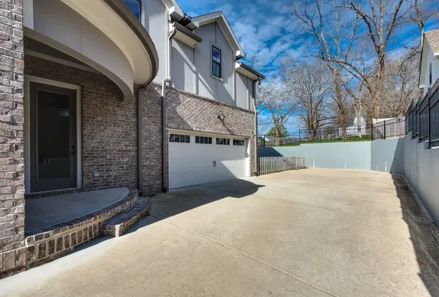 a view of a house with a snow in a yard