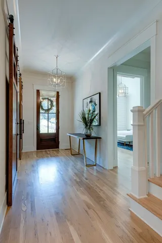 a view of livingroom with furniture wooden floor and windows
