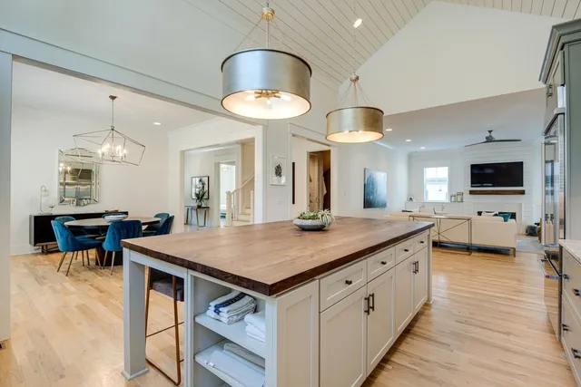 an open kitchen with a table and chairs in it