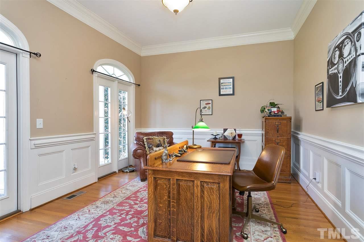 2521 Hunters Meadow Lane Raleigh, NC 27606 - Photo 4 of 30 a work room with furniture and wooden floor