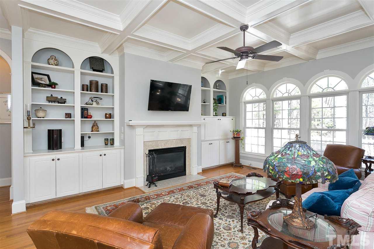 2521 Hunters Meadow Lane Raleigh, NC 27606 - Photo 8 of 30 a living room with furniture fireplace and flat screen tv