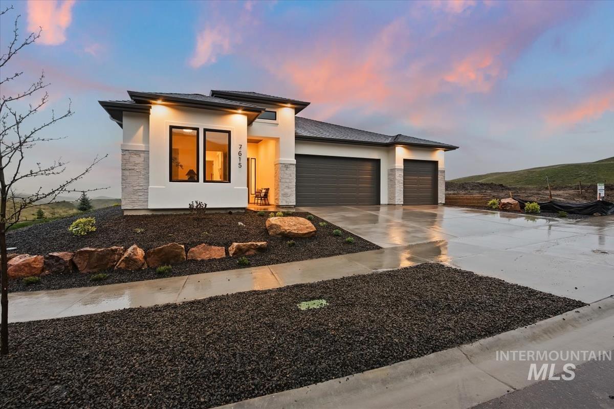 7615 Brown Way Eagle, ID 83714 - Photo 3 of 43 Contemporary exterior with a smooth stucco finish and stone accents