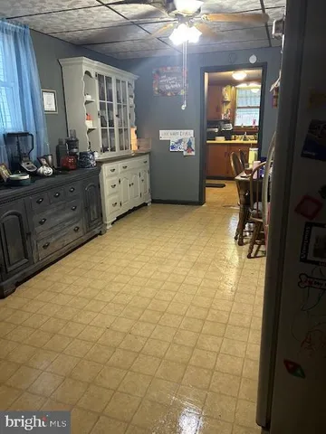 a white refrigerator freezer sitting next to a white wall