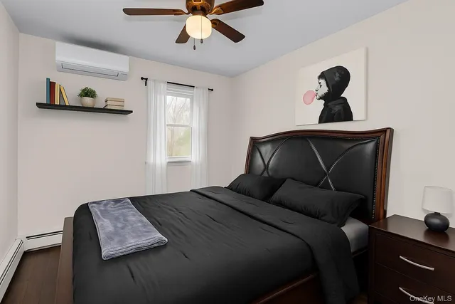 a bedroom with bed and window