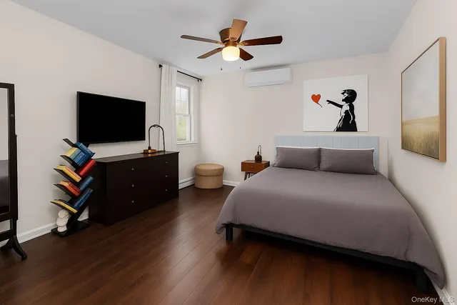 a bedroom with bed and a chandelier