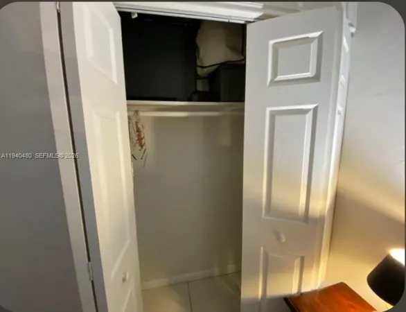 a bathroom with a sink mirror vanity and toilet