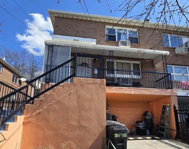 a view of a house with pool and sitting area