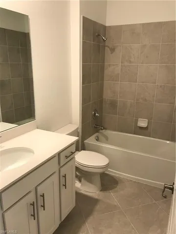 a bathroom with a sink a toilet and bathtub