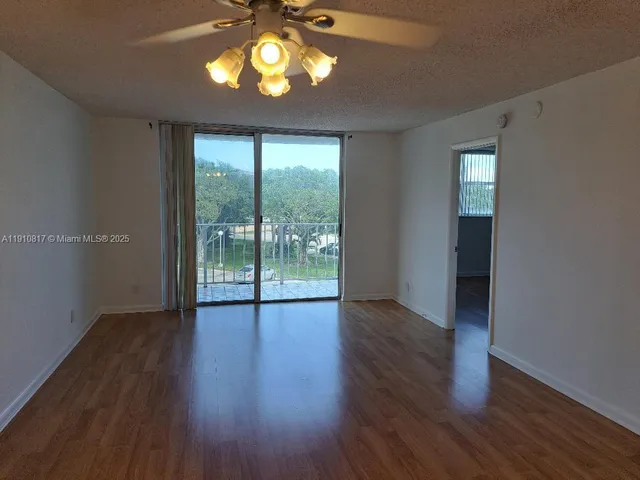 a bathroom with a granite countertop toilet and a sink