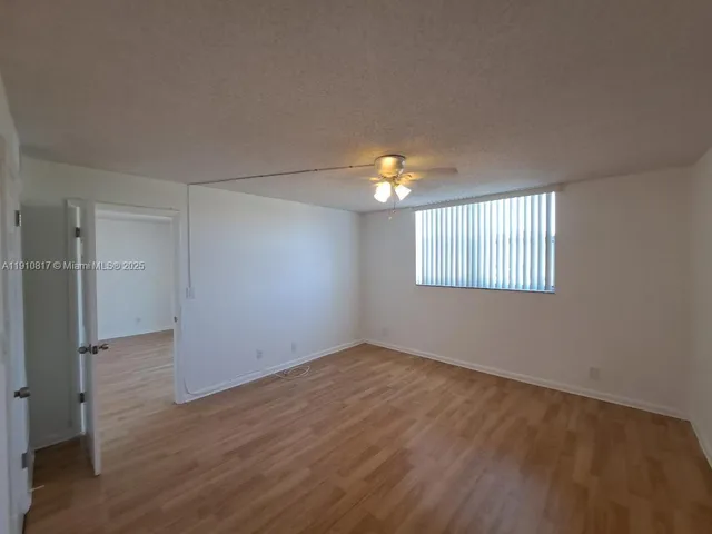 a bathroom with a sink a toilet a mirror and bathtub