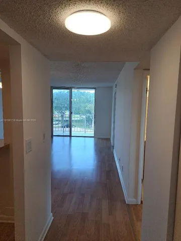 a kitchen with a sink cabinets and appliances
