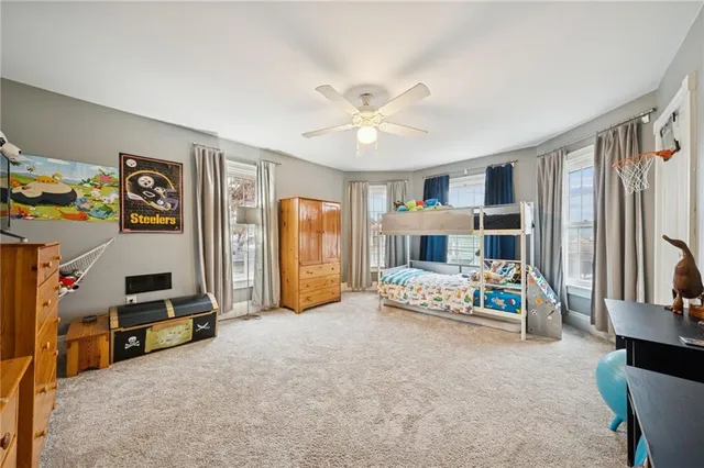 a view of a livingroom with furniture and a flat screen tv