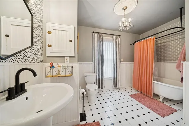 a front view of a house with a yard patio and fire pit