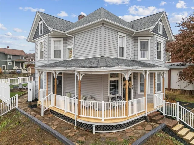 a view of house with a porch