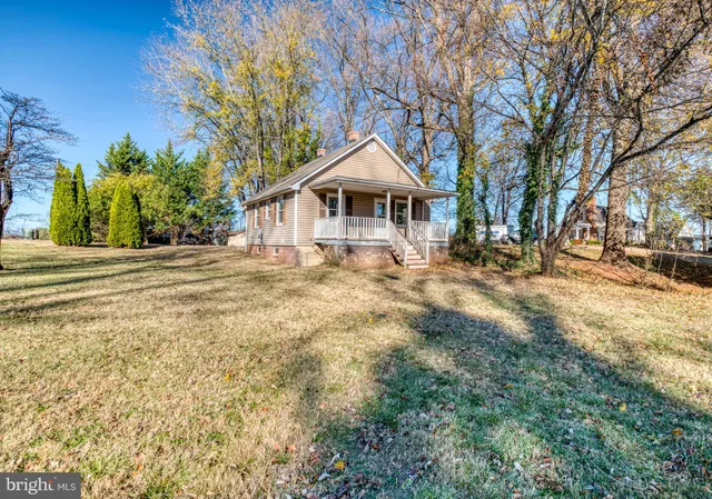 a house with trees in the background