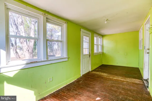 a view of a big room with windows