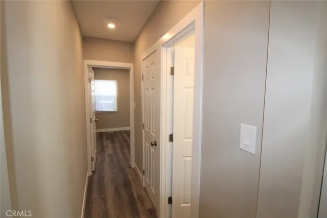 a view of a bathroom from a hallway