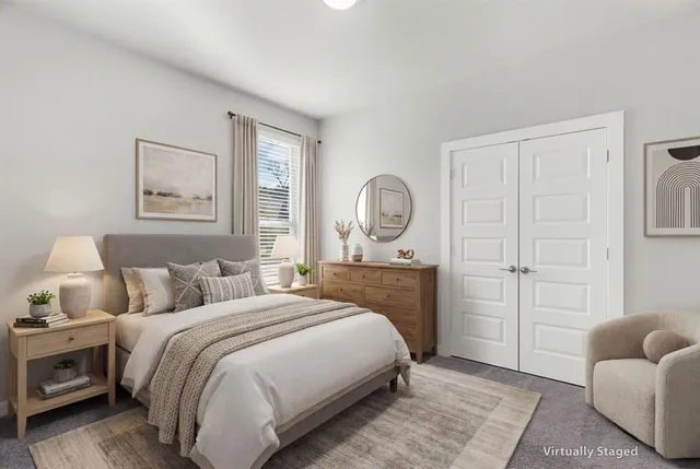 a bedroom with a bed and window