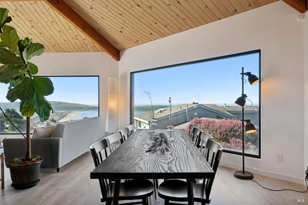 a living room with furniture a table and chairs