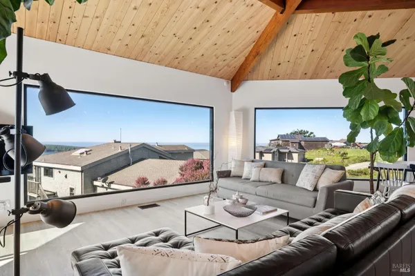 an aerial view of ocean with residential house with outdoor space