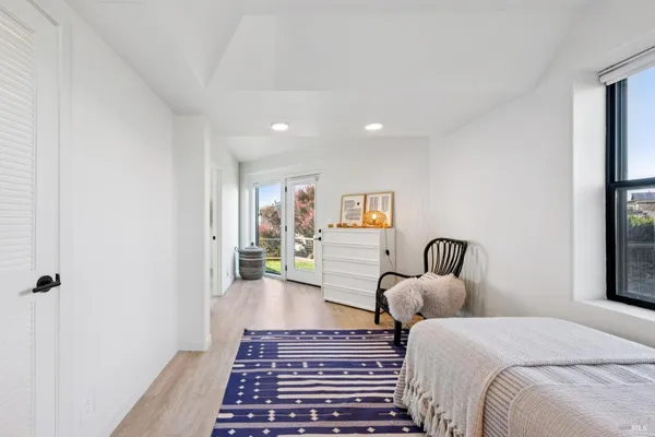 a bed room with a bed and a television