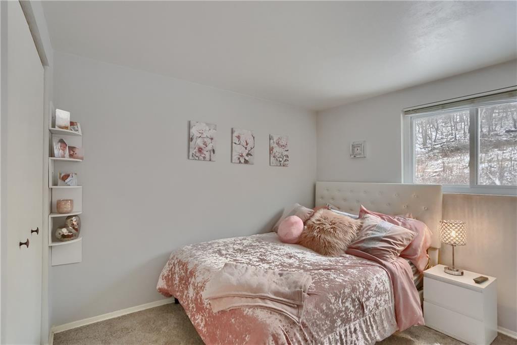 236 Timber Drive Trafford, PA 15085 - Photo 11 of 16 a bedroom with a bed and a window