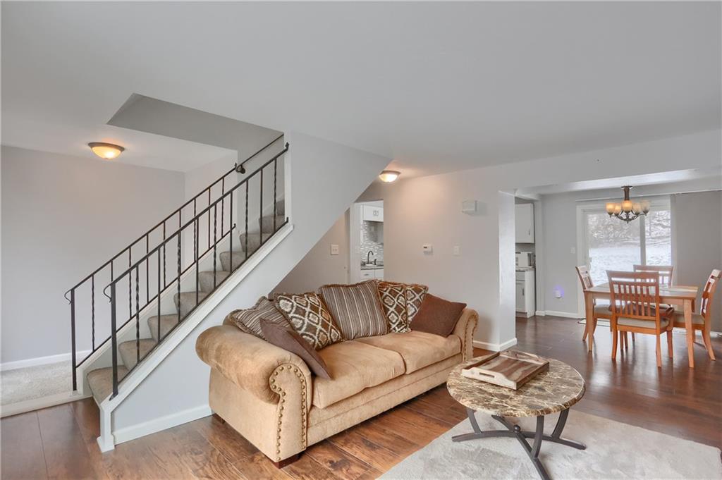 236 Timber Drive Trafford, PA 15085 - Photo 4 of 16 a living room with fireplace furniture and a dining table