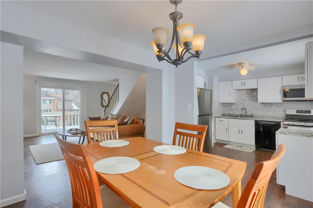 236 Timber Drive Trafford, PA 15085 - Photo 5 of 16 a dining room filled chandelier and wooden floor