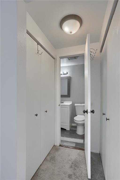 236 Timber Drive Trafford, PA 15085 - Photo 10 of 16 a bathroom with a toilet sink and a mirror