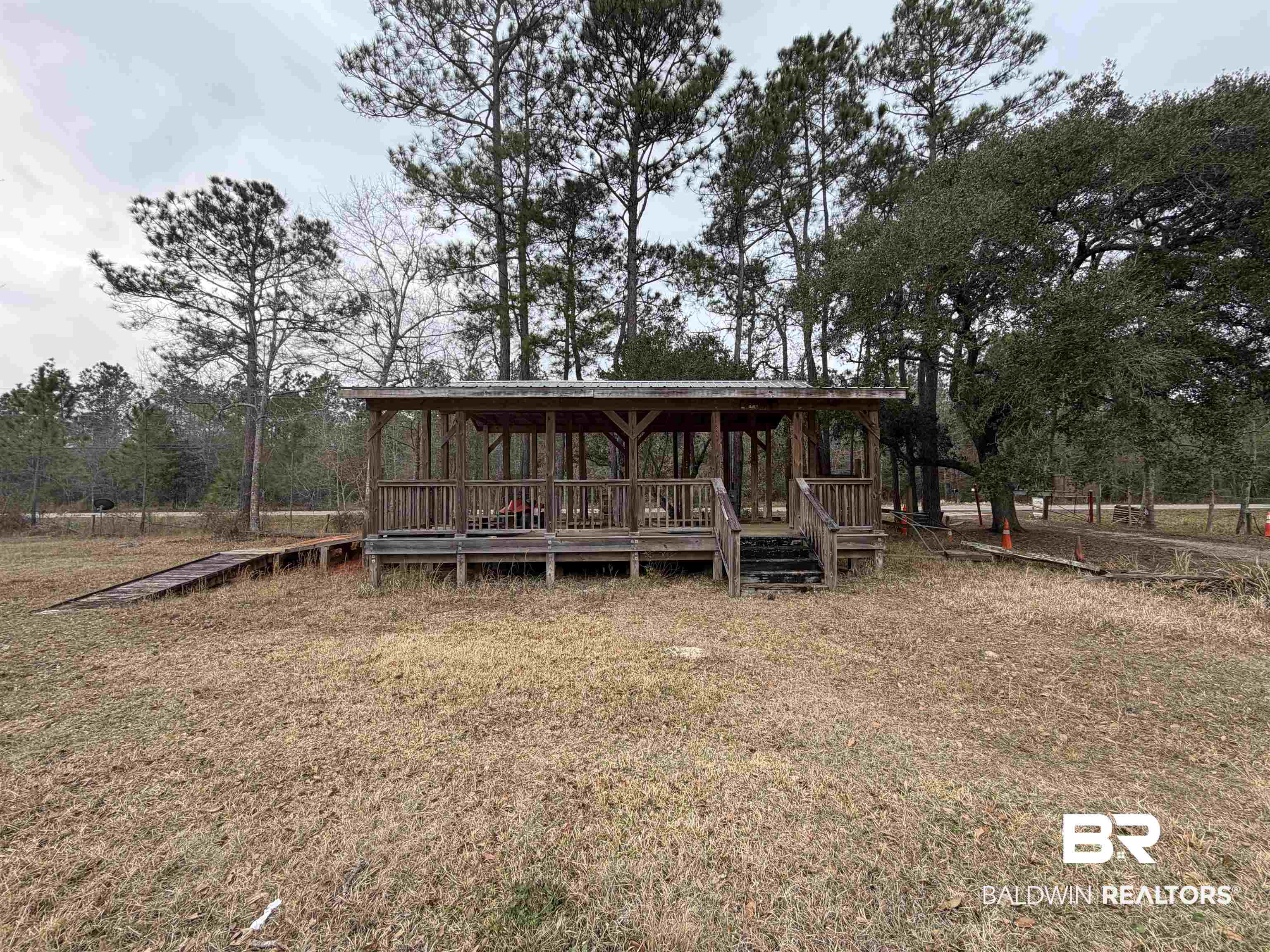 10585 Bellingrath Road Theodore, AL 36582 - Photo 5 of 14 View of front of property with a front yard and a porch