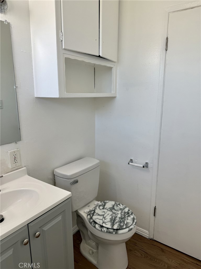 4830 Canoga Street, Unit J Montclair, CA 91763 - Photo 12 of 12 a bathroom with a sink and a toilet