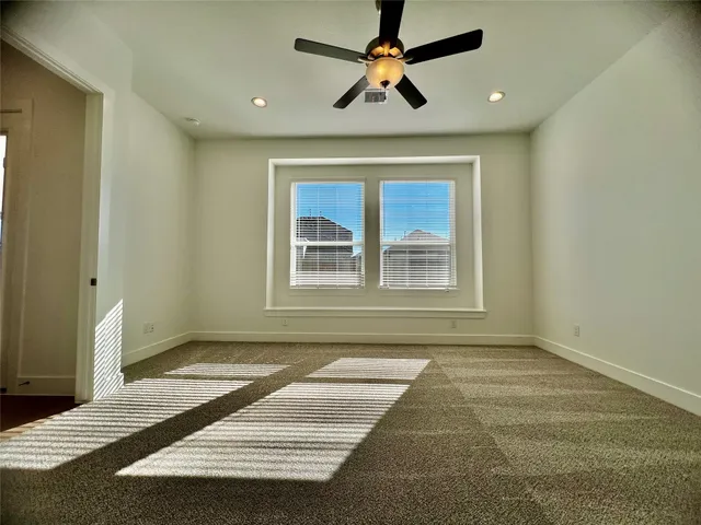 a view of livingroom with window and ceiling fan