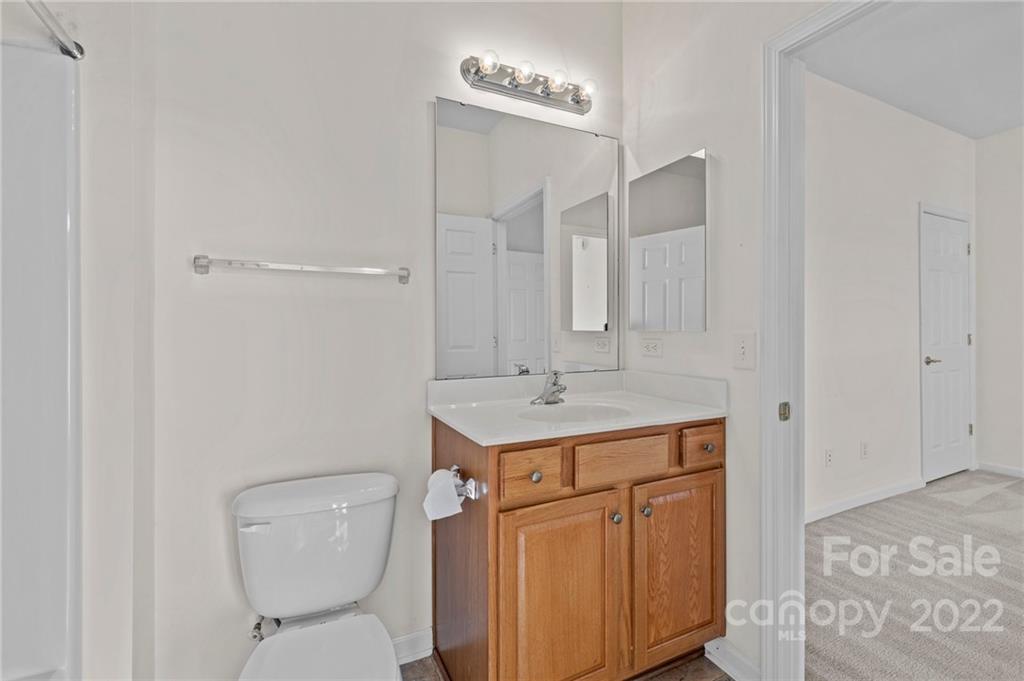 220 Garnet Court Fort Mill, SC 29708 - Photo 15 of 36 a bathroom with a toilet sink and mirror