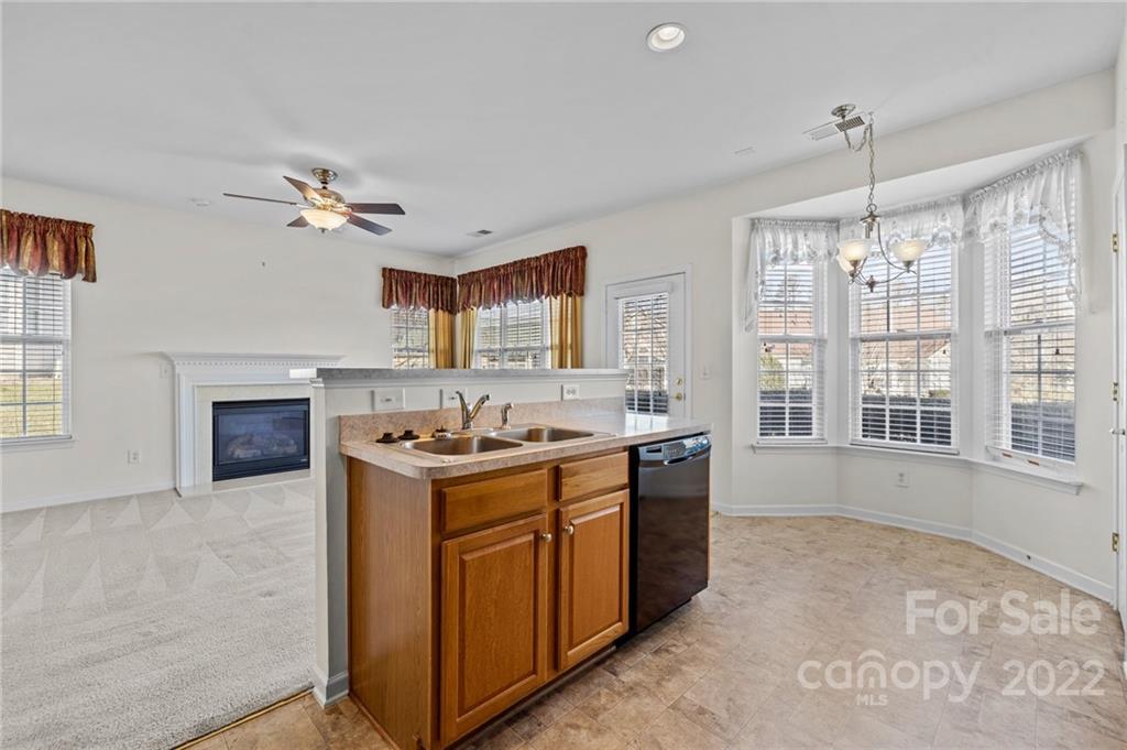 220 Garnet Court Fort Mill, SC 29708 - Photo 33 of 36 a kitchen with a stove and a sink