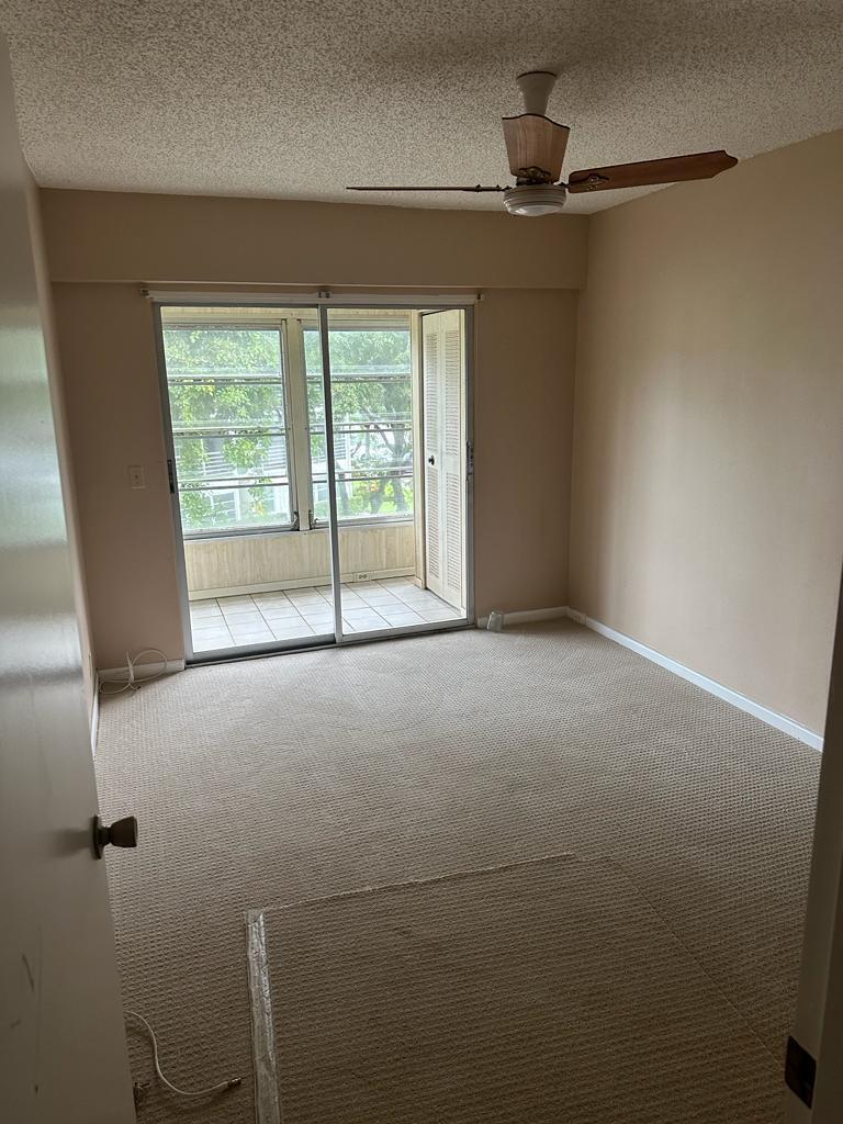 251 Fanshaw F Boca Raton, FL 33434 - Photo 8 of 14 a view of an empty room with a window