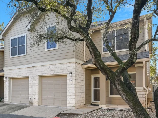 a front view of a house with large windows