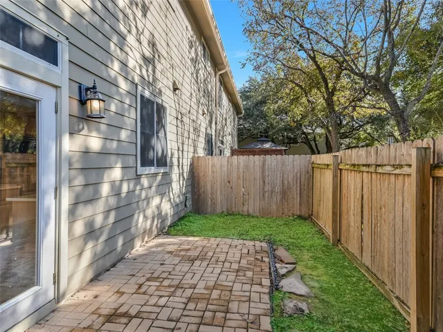 a view of backyard with large trees