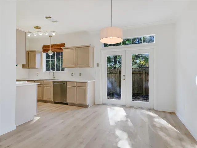 a kitchen with a sink stove and refrigerator