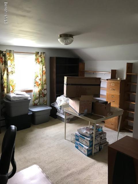 1335 Savoy Road Windsor, MA 01270 - Photo 14 of 23 a living room with furniture a window and a fireplace