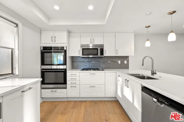 a bathroom with a granite countertop sink mirror and double