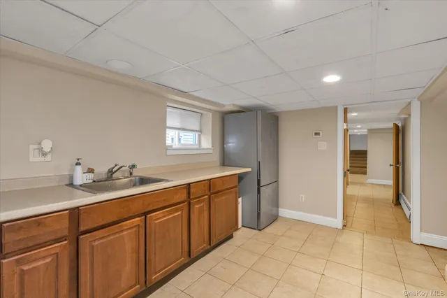 a spacious bathroom with a granite countertop sink and a mirror