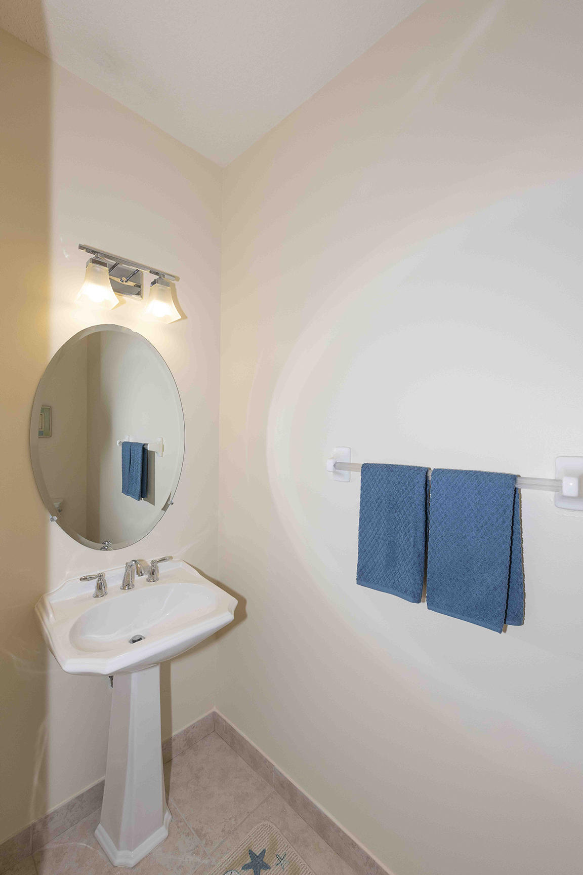 107 Mulligan Place Jupiter, FL 33458 - Photo 19 of 43 a bathroom with a sink and a mirror